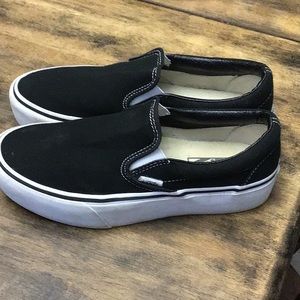 Black Vans slip ons